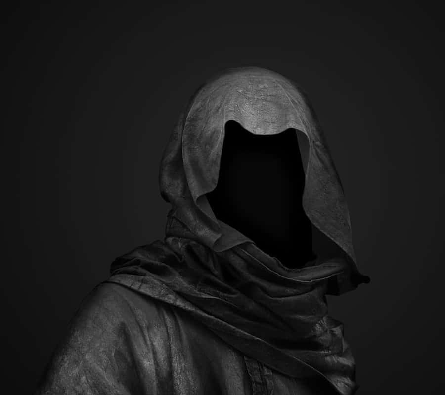 A Black And White Image Of A Man In A Hooded Robe Wallpaper