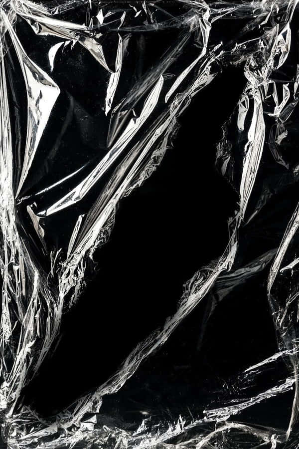 A Black Plastic Cover With A Black Background Wallpaper