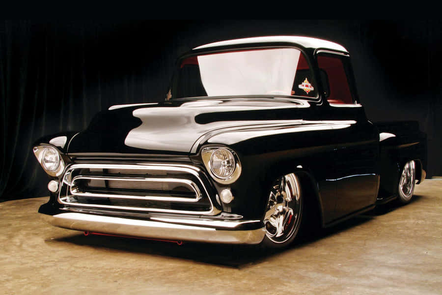 A Black Truck With Chrome Trim Wallpaper