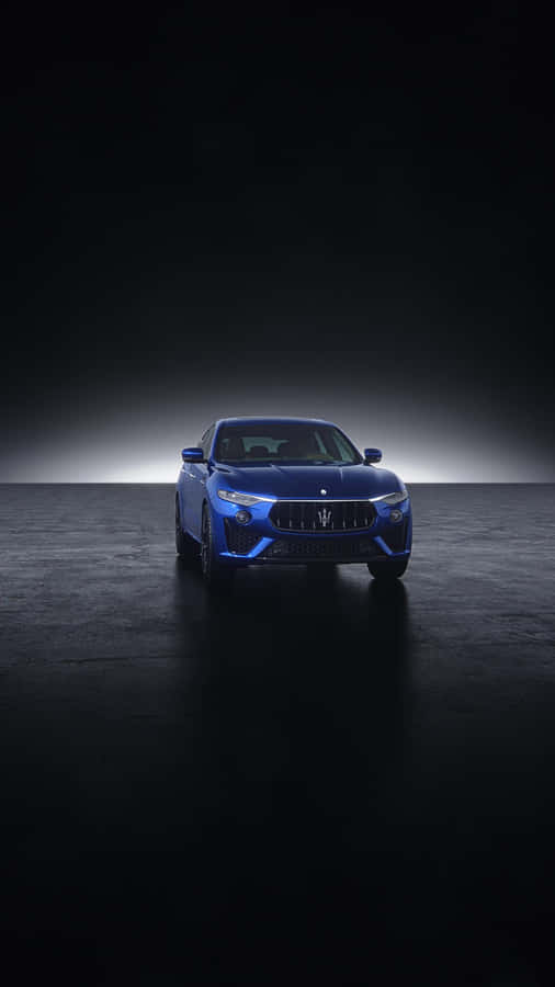 A Blue Car Poised For Its Next Adventure Wallpaper