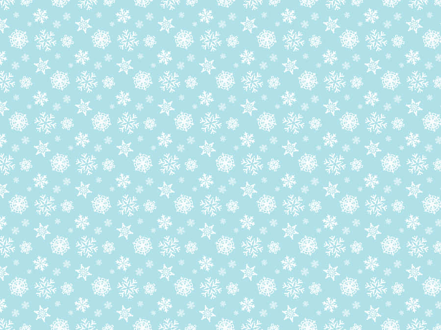 A Blue Snowflake Pattern With White Snowflakes Wallpaper