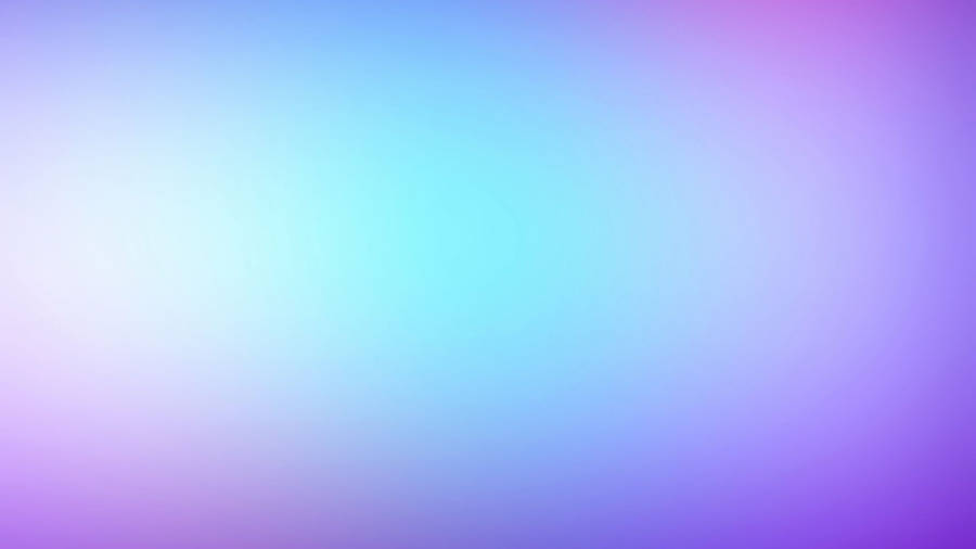 A Blurred Background With Blue And Purple Colors Wallpaper