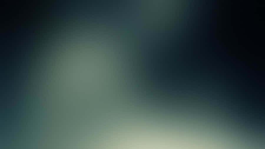 A Blurry Image Of A Green And Blue Sky Wallpaper