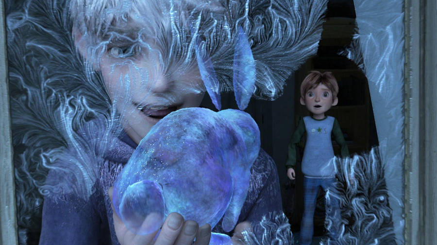 A Boy Is Holding A Frozen Ball In His Hands Wallpaper