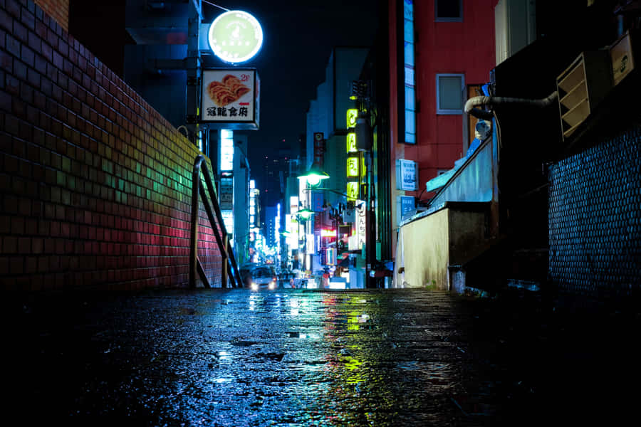 A Brilliant Nightscape Of Kyōto, Japan Dominated By Red Neon Signage Wallpaper