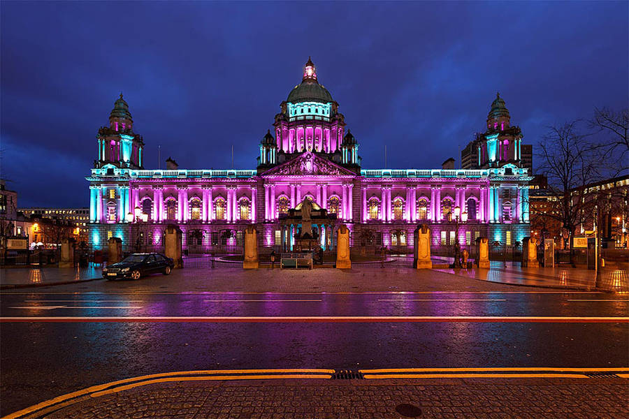 A Building With Lights On It Wallpaper