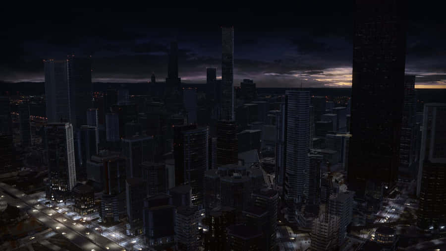 A City At Night With Tall Buildings Wallpaper