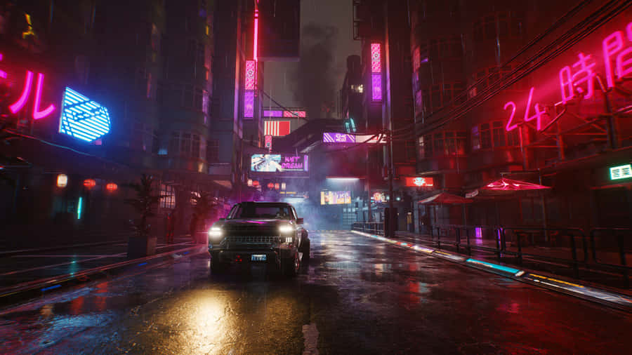 A City Street With Neon Lights And Neon Signs Wallpaper