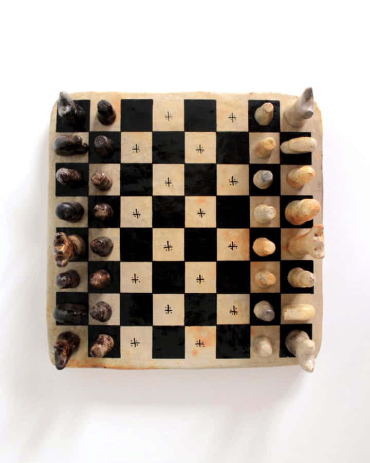 A Classic Game Of Chess On A Wooden Chessboard Wallpaper
