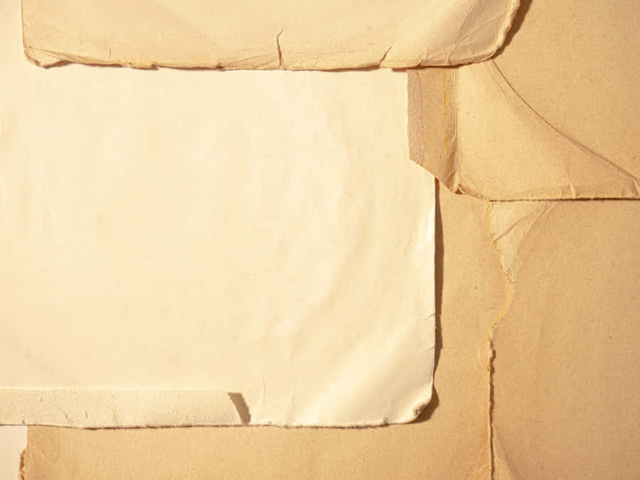 A Close-up Image Of Paper With Torn Edges Wallpaper