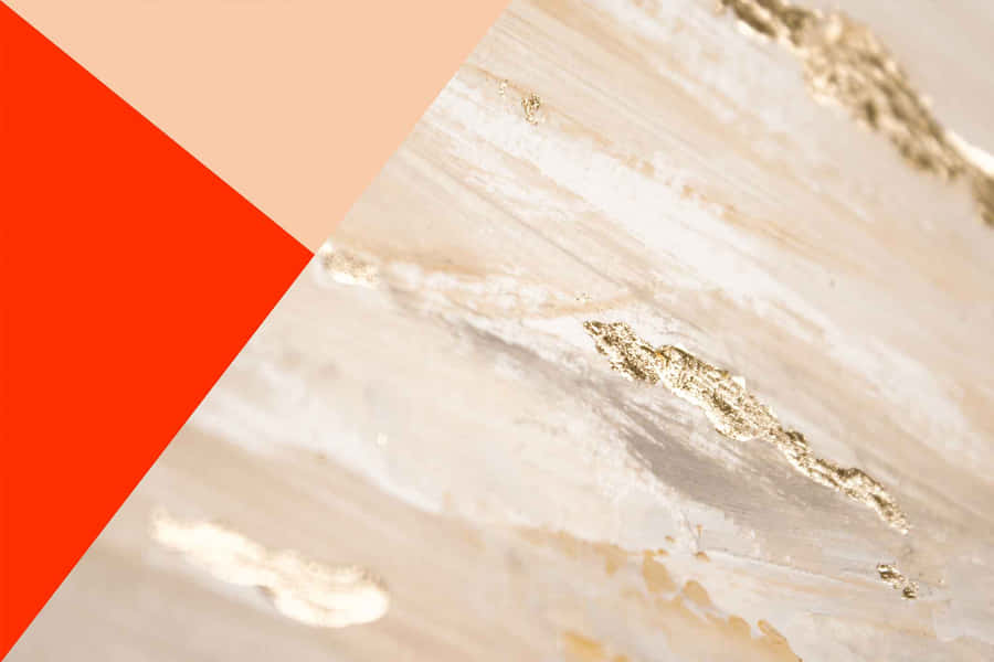 A Close Up Of A Gold And Orange Colored Background Wallpaper