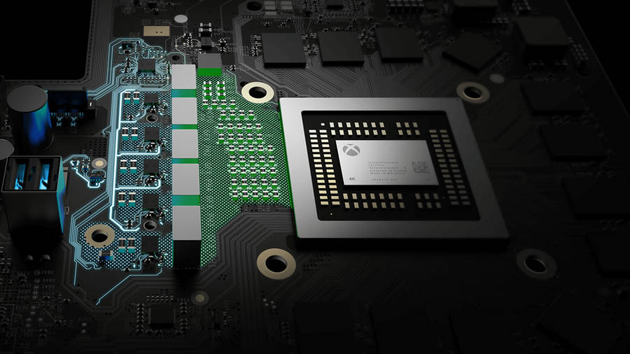 A Close Up Of A Motherboard With A Green Chip Wallpaper