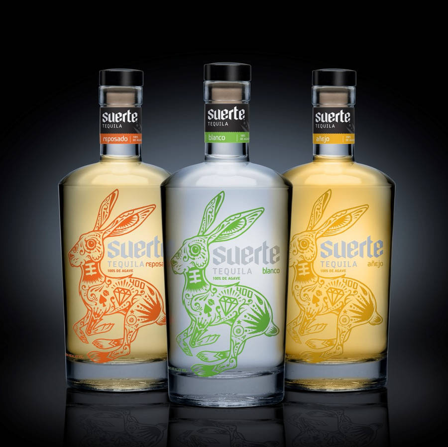 A Collection Of Suerte Tequila Bottles Wallpaper