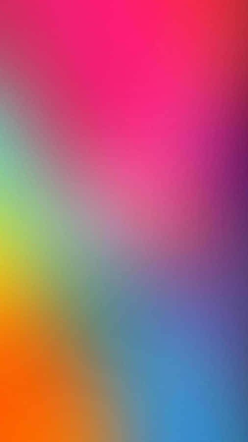 A Colorful Blurred Background With A Rainbow Of Colors Wallpaper