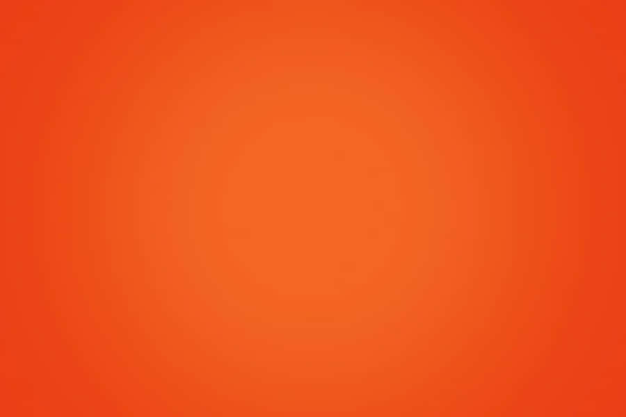 A Contrast Between Mundane And Vibrancy With Plain Orange Wallpaper