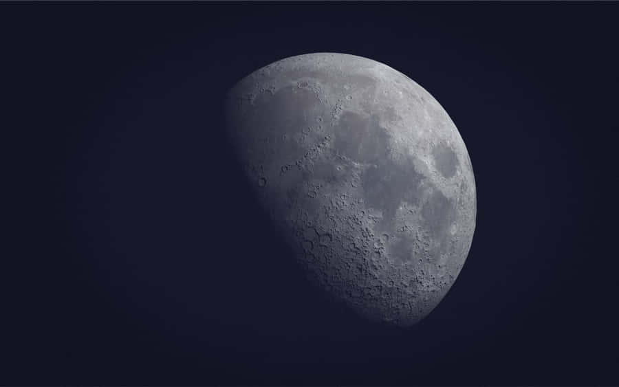 A Cool Moon Shining Brightly In The Night Sky Wallpaper