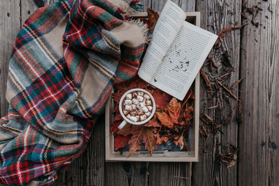 A Cup Of Coffee And Book On A Wooden Table Wallpaper