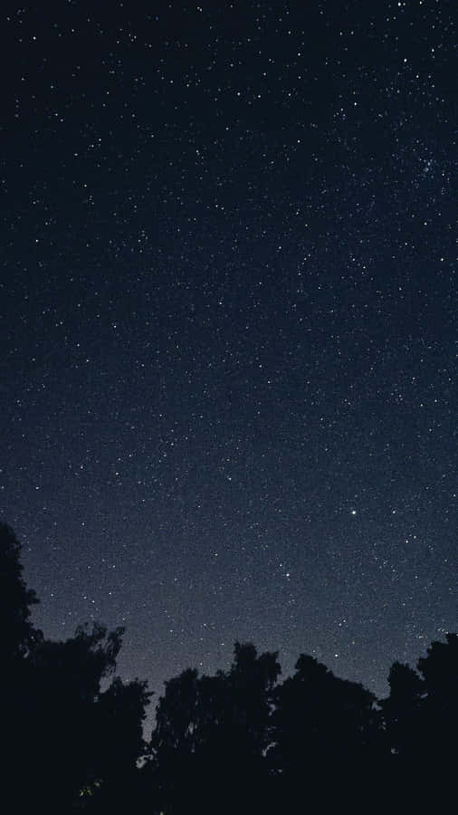 A Dark Starry Night Sky With Stars Illuminated In The Night Sky. Wallpaper