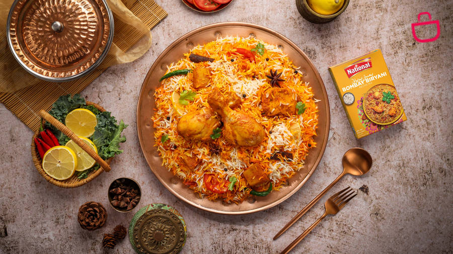 A Delicious Plate Of Golden Yellow Biryani Wallpaper