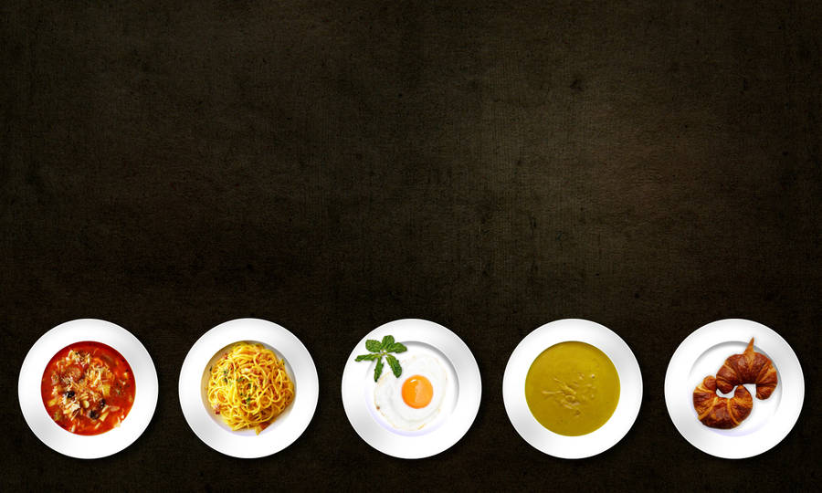 A Feast For The Eyes - Five Assorted Plates Of Delectable Cuisine. Wallpaper