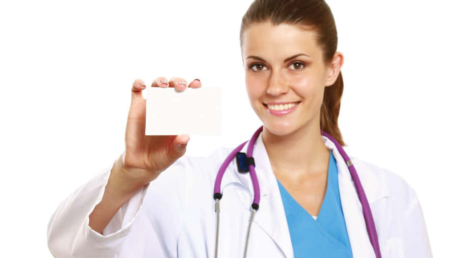 A Female Doctor Holding Up A Blank Card Wallpaper