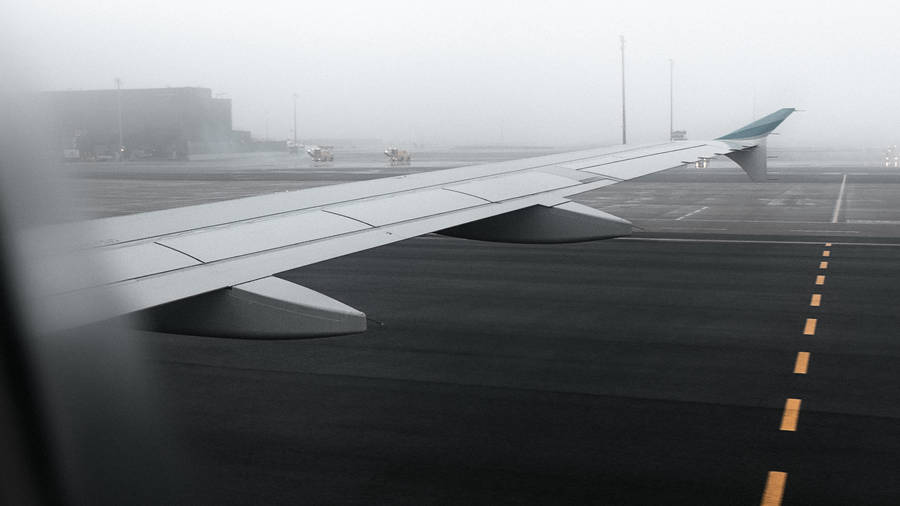 A Foggy Plane Window View Wallpaper