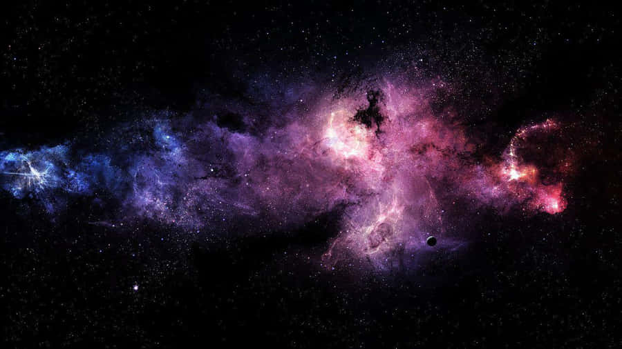 A Galaxy With Stars And Nebulas Wallpaper