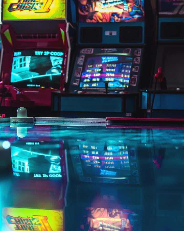 A Game Room With A Pool Table And Arcade Machines Wallpaper