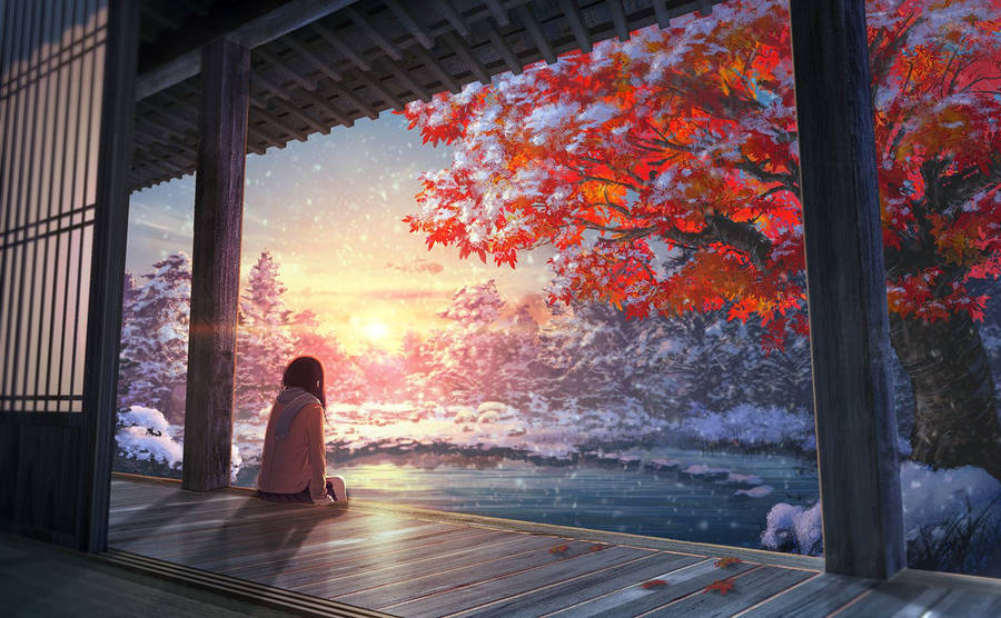 A Girl Is Sitting On A Porch Looking Out At The Snow Wallpaper