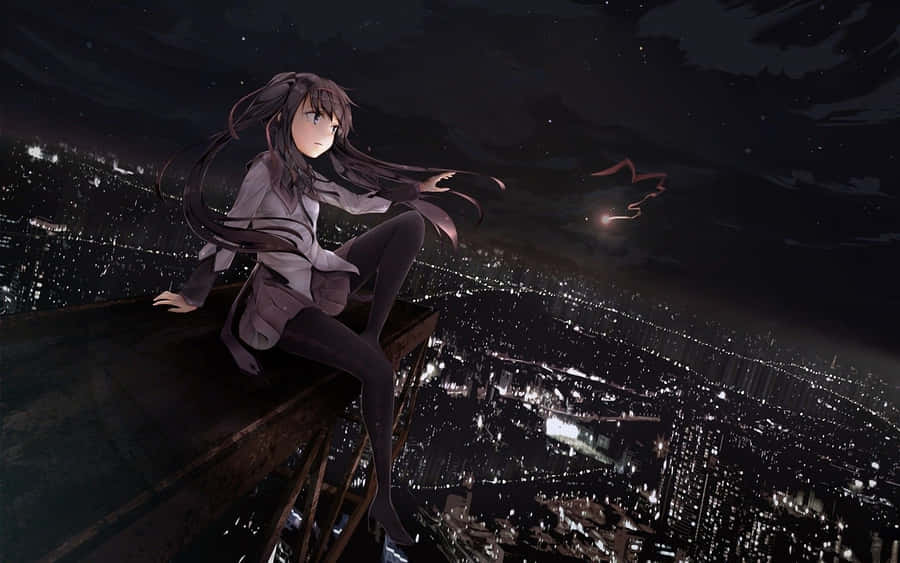 A Girl Sitting On A Ledge In A City At Night Wallpaper