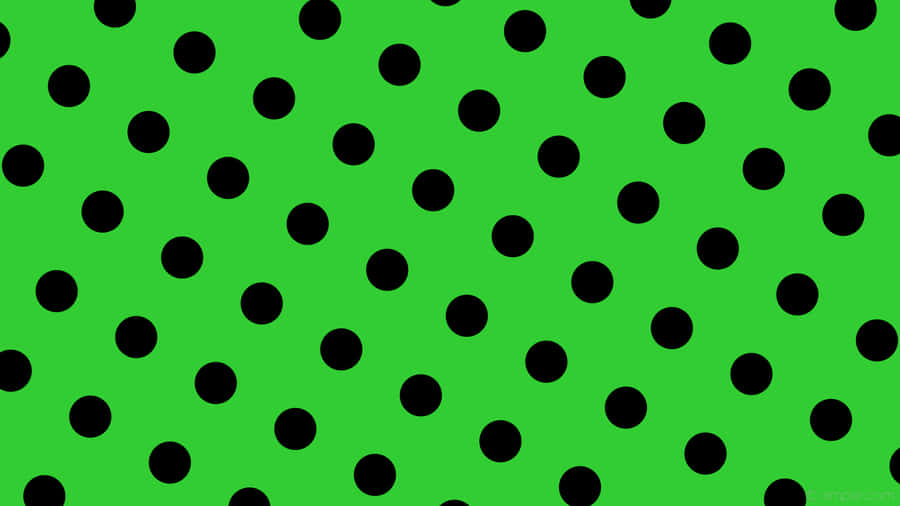 A Green Background With Black Dots Wallpaper