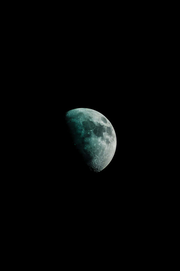 A Green Moon In The Dark Sky Wallpaper