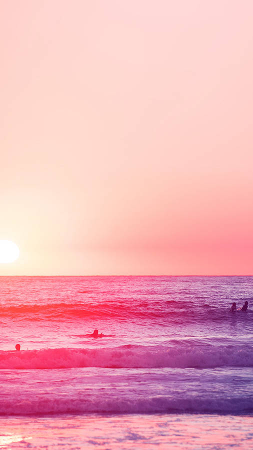 A Group Of People Are Surfing In The Ocean Wallpaper