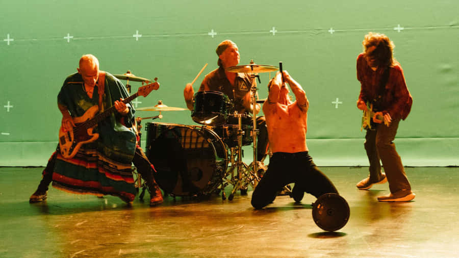 A Group Of People On Stage With Drums And Drums Wallpaper