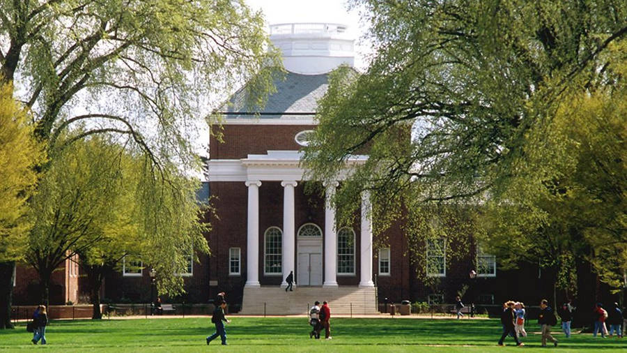 A Group Of Students Strolling Through The Scenic University Of Delaware Campus Wallpaper