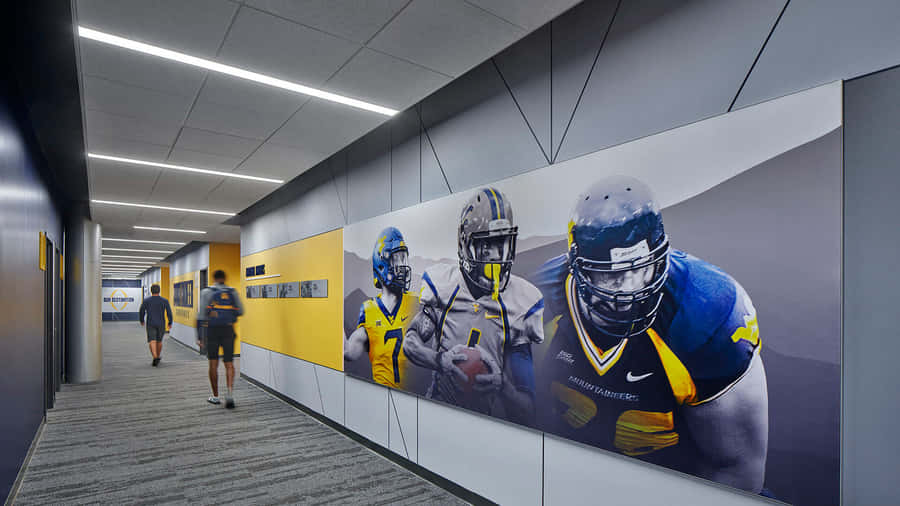 A Hallway With Football Players And Posters Wallpaper