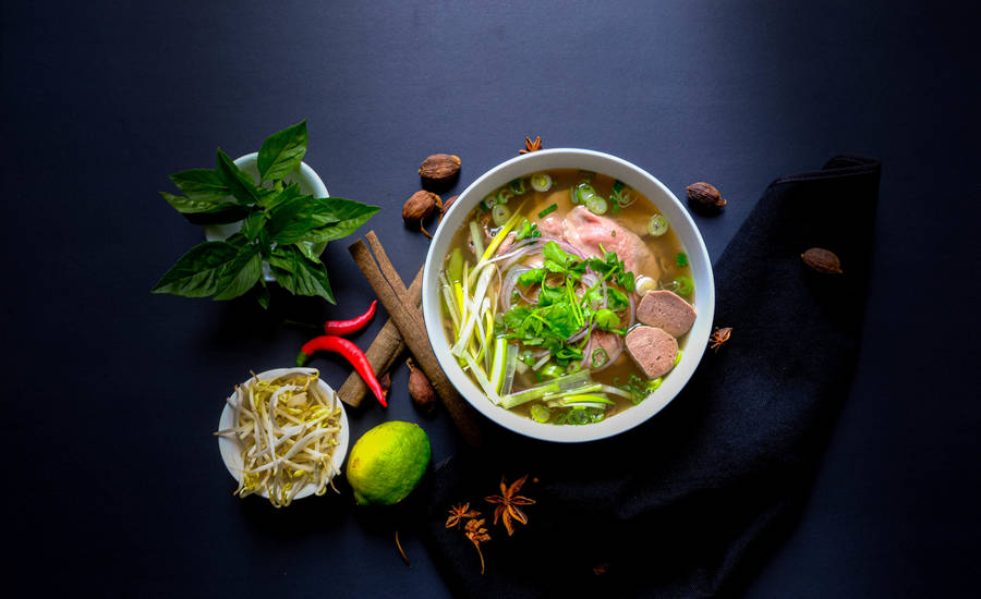 A Hearty Bowl Of Pho Vietnamese Spicy Noodles Wallpaper