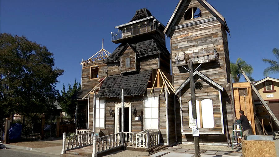 A House Made Out Of Wood And A Staircase Wallpaper