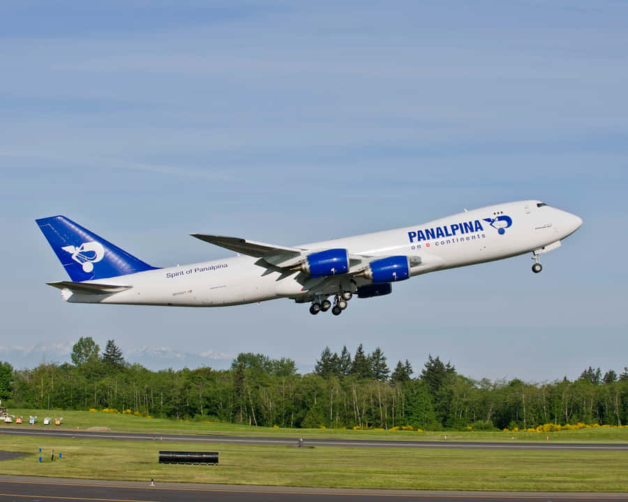 A Huge Jumbo Jet Take Off Under The Cloudy Sky Wallpaper