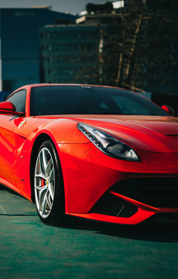 A Lamborghini Car Displaying The Latest 4k Iphone Device Wallpaper