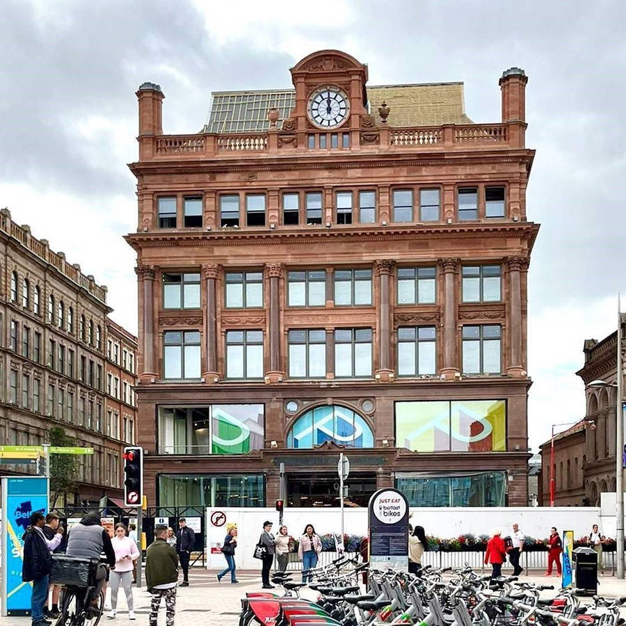 A Large Building With A Clock On It Wallpaper