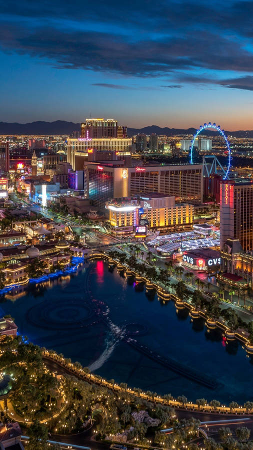 A Majestic View Of The Flamingo Hotel In Las Vegas Under The Star-studded Night Sky Wallpaper