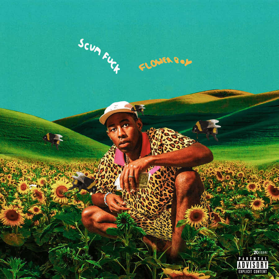 A Man In A Yellow Shirt Is Sitting In A Field Of Sunflowers Wallpaper