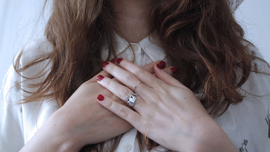 A Man's Hand Sporting A Sleek Signet Ring Wallpaper