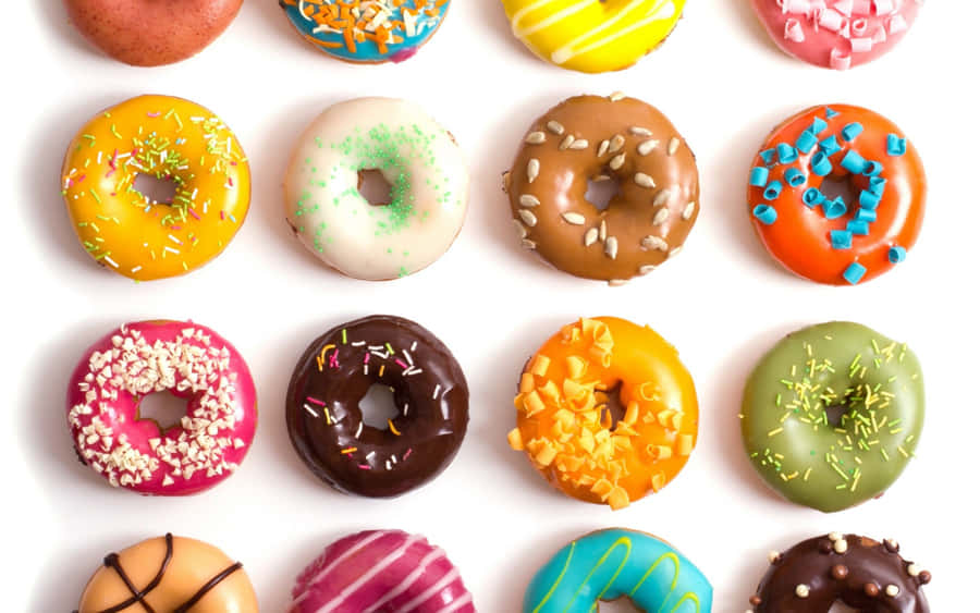 A Mouthwatering Display Of Assorted Donuts Wallpaper