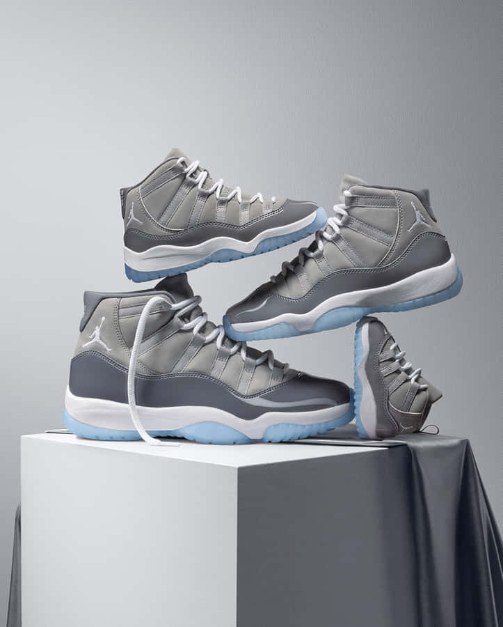 A Pair Of Air Jordan 11's On A White Box Wallpaper