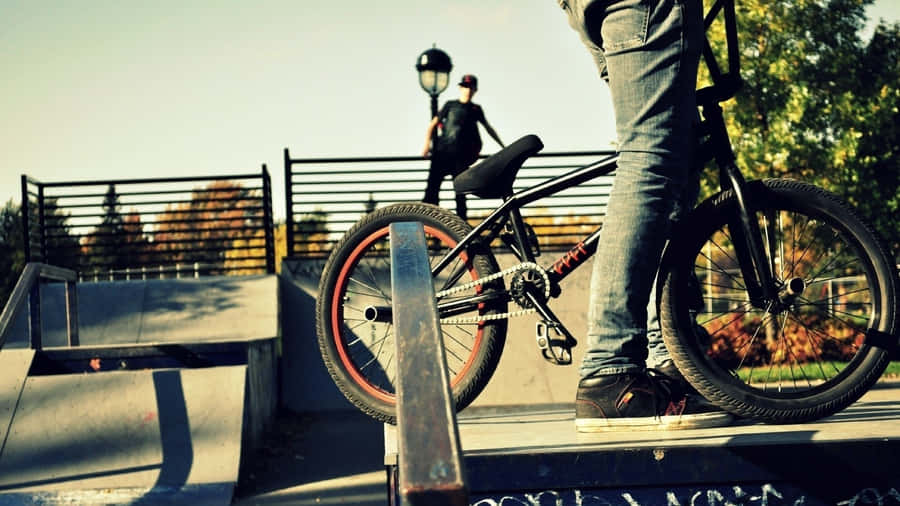 A Person Riding A Bike On A Ramp Wallpaper