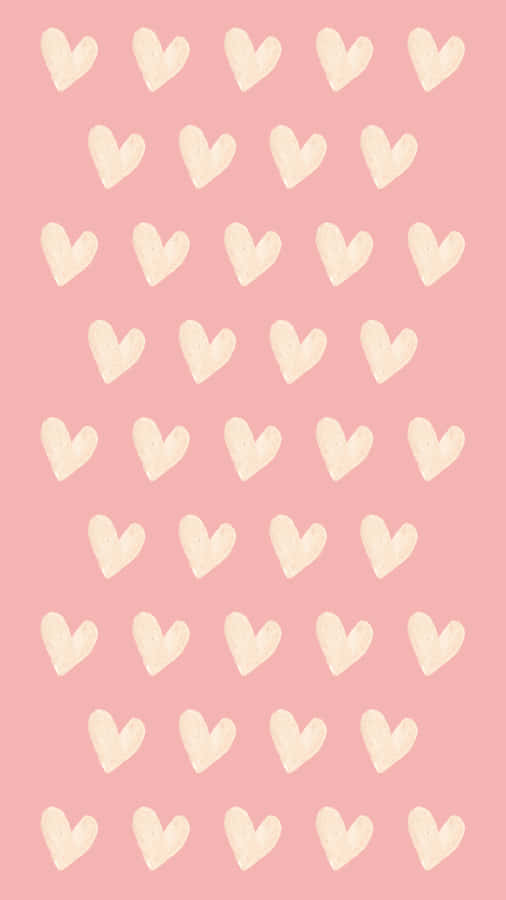 A Pink Background With White Hearts On It Wallpaper