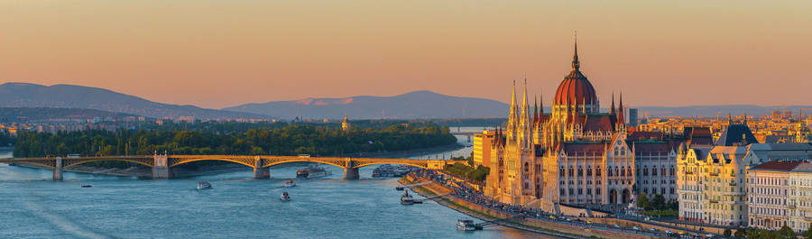 A River With Buildings And Boats Wallpaper