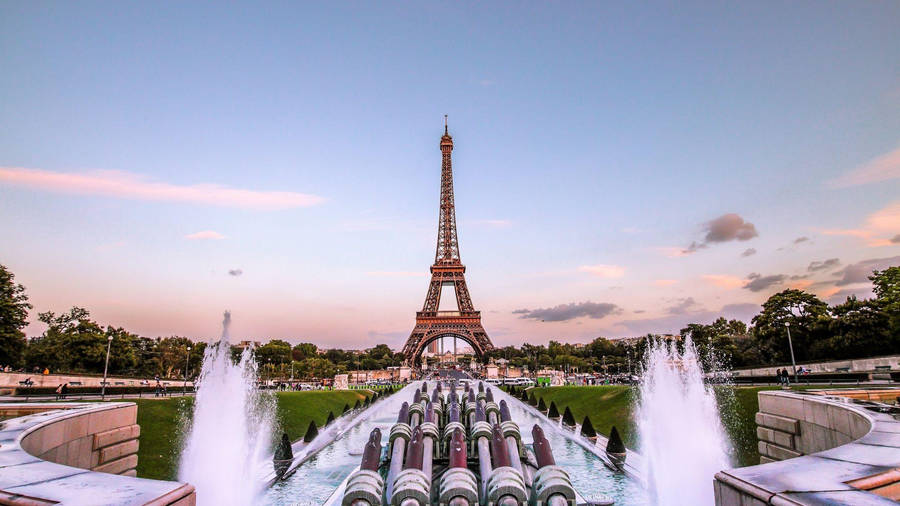 A Romantic View Of The Iconic Eiffel Tower, Sparkling In The Lights Of Paris. Wallpaper